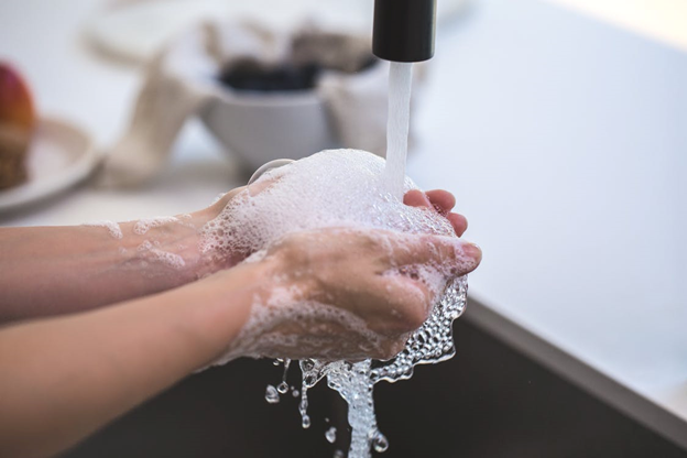 Handwashing to promote safety while social distancing at work